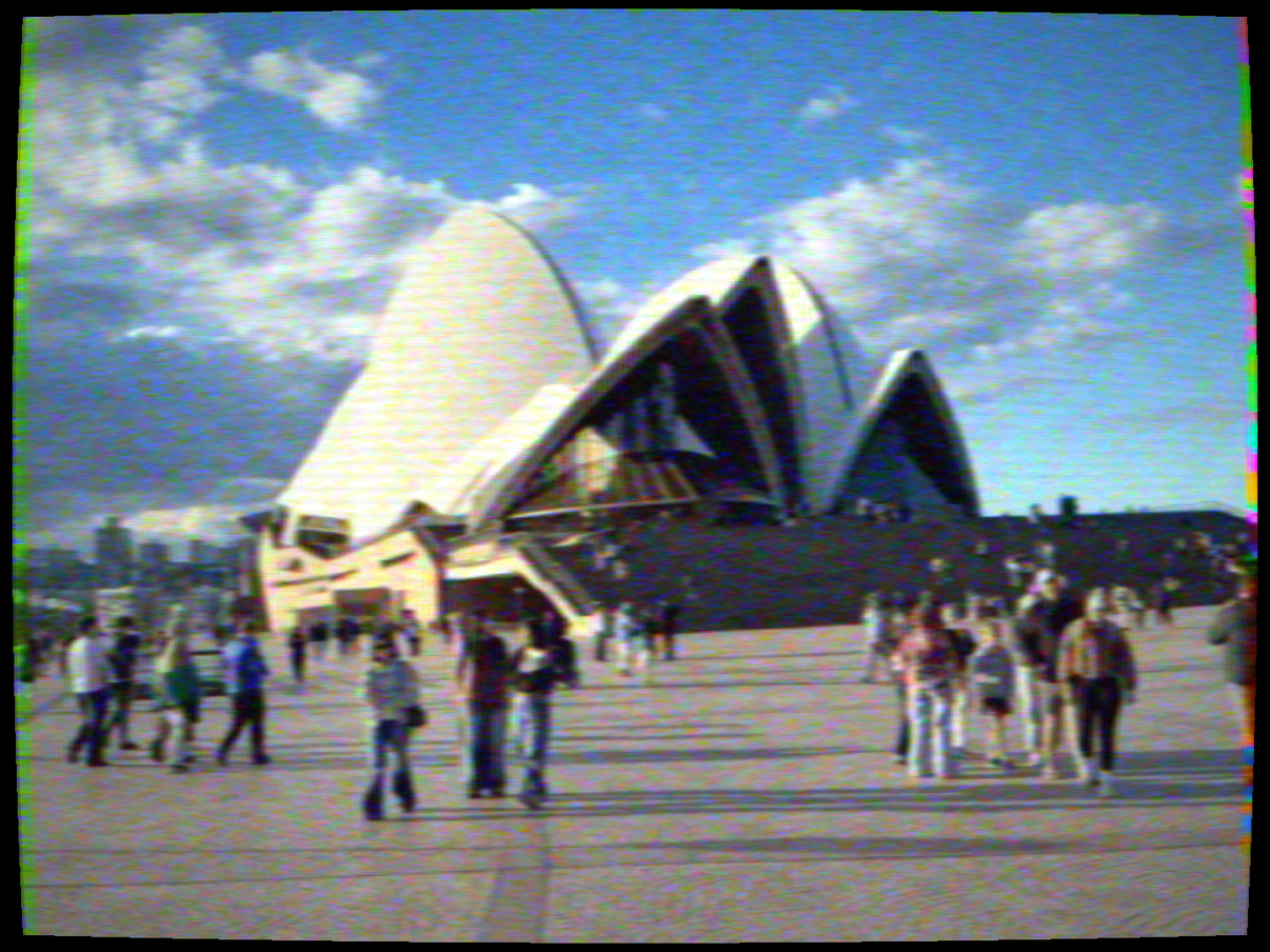 A photo of the Sydney Opera House run through a simulated SECAM colour signal, with colour noise and grain